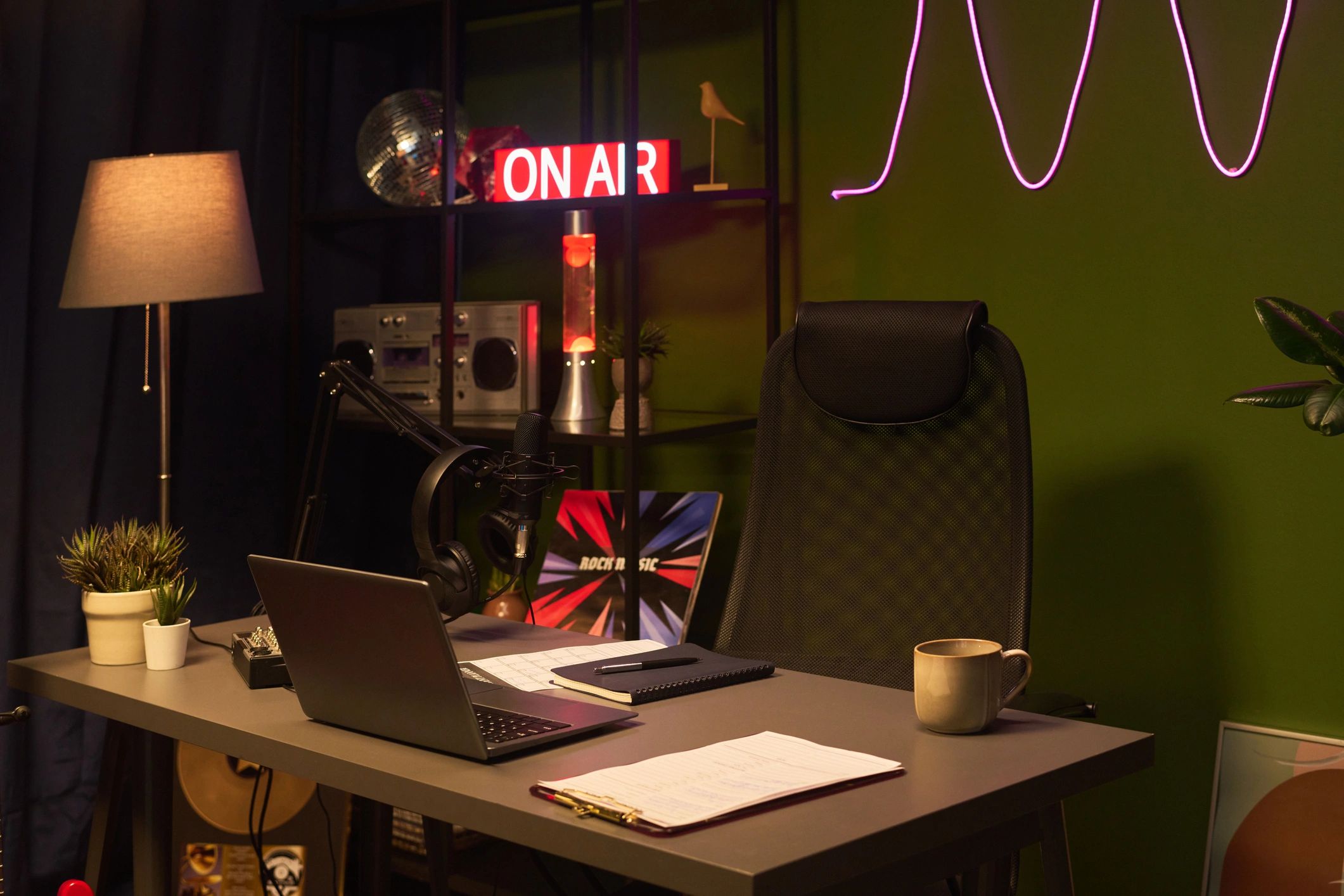 Podcast studio workspace with microphone and headphones